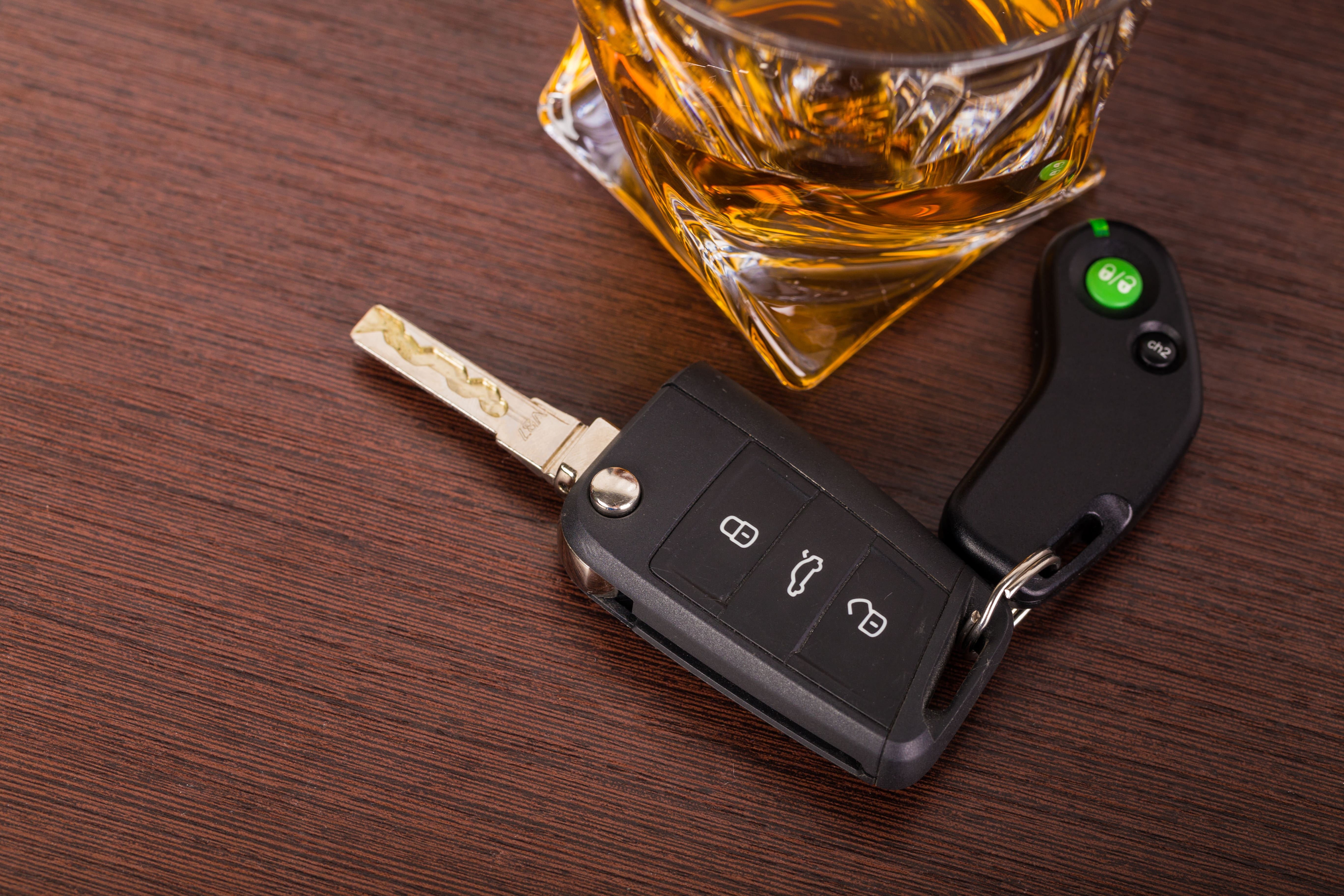 Glass of alcohol with car keys